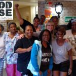 A FoodWIse StrongBodies class celebrates at the end of a fitness session.
